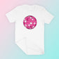 My free Disco Ball SVG is part of my free retro SVG files for Cricut collection, and features a mockup of a pink disco ball on a t-shirt.